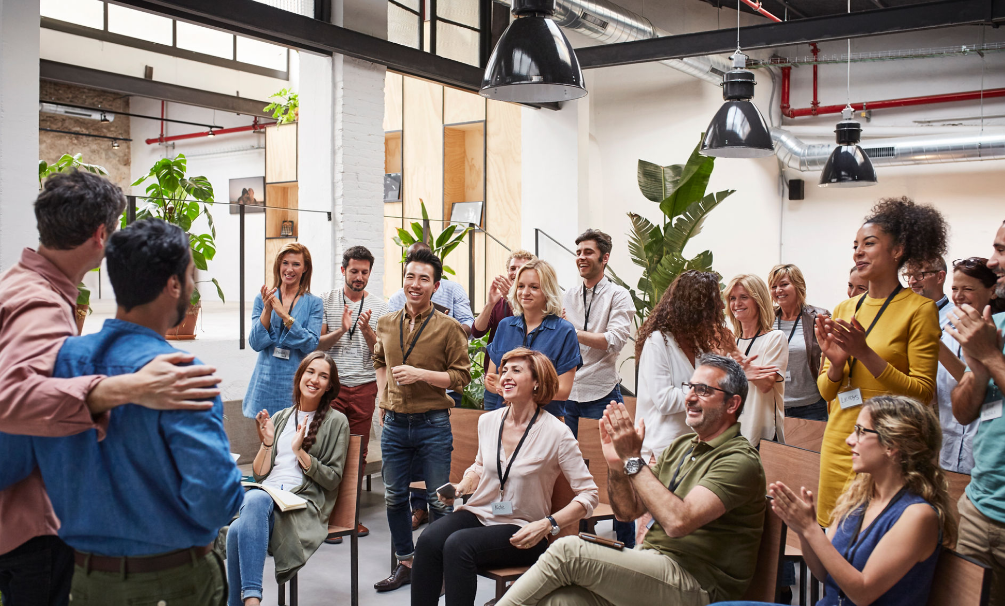 Big Department meeting where the team is congratulating their progress